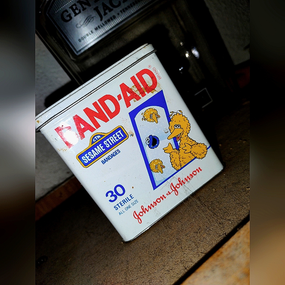 Vintage bandaid tin can